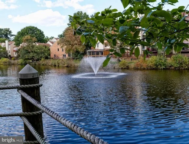 a balcony with residential houses and lake view