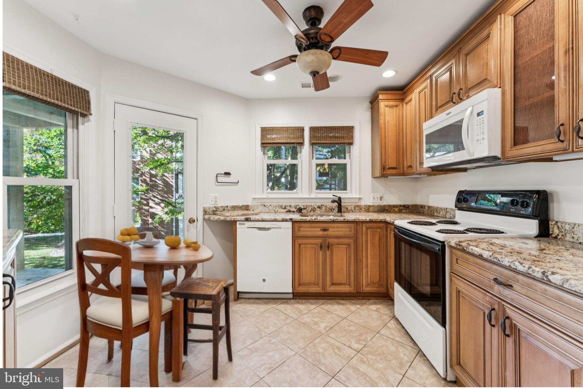 3152 B Covewood Court Falls Church, VA 22042 - Photo 3 of 26 a kitchen with stainless steel appliances granite countertop a stove a sink and a refrigerator