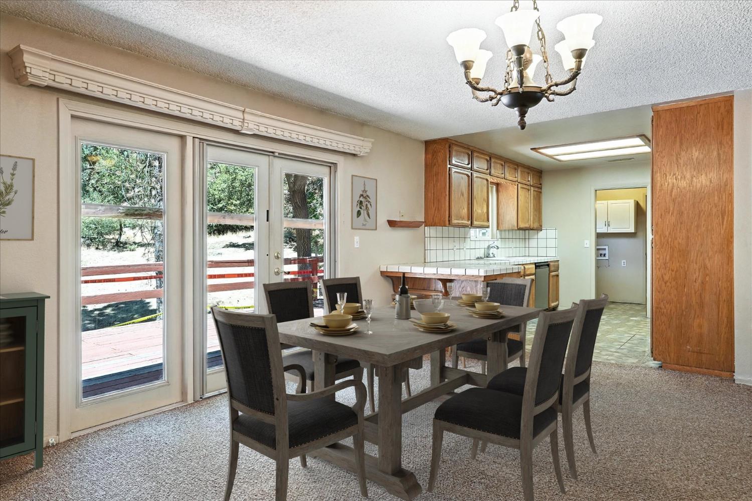 5783 Chowchilla Mountain Road Mariposa, CA 95338 - Photo 13 of 43 a view of a dining room with furniture window and outside view