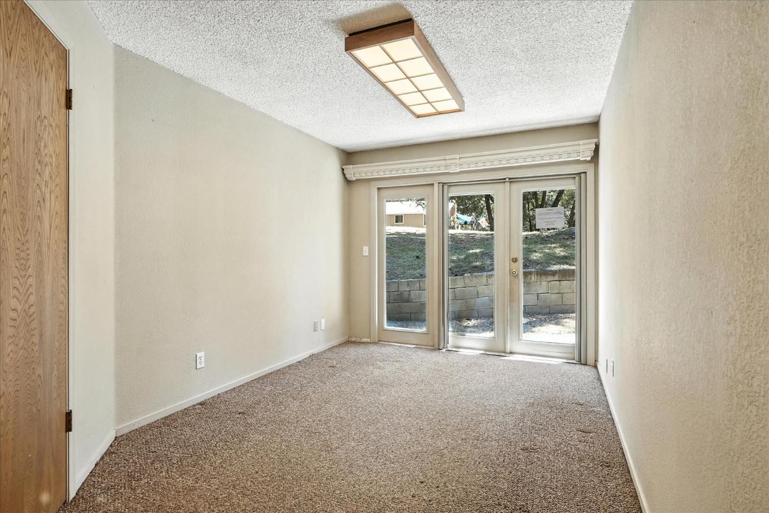 5783 Chowchilla Mountain Road Mariposa, CA 95338 - Photo 21 of 43 a view of an empty room with a window