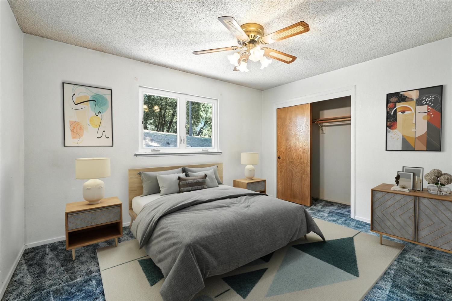 5783 Chowchilla Mountain Road Mariposa, CA 95338 - Photo 27 of 43 a bedroom with a bed and a chandelier