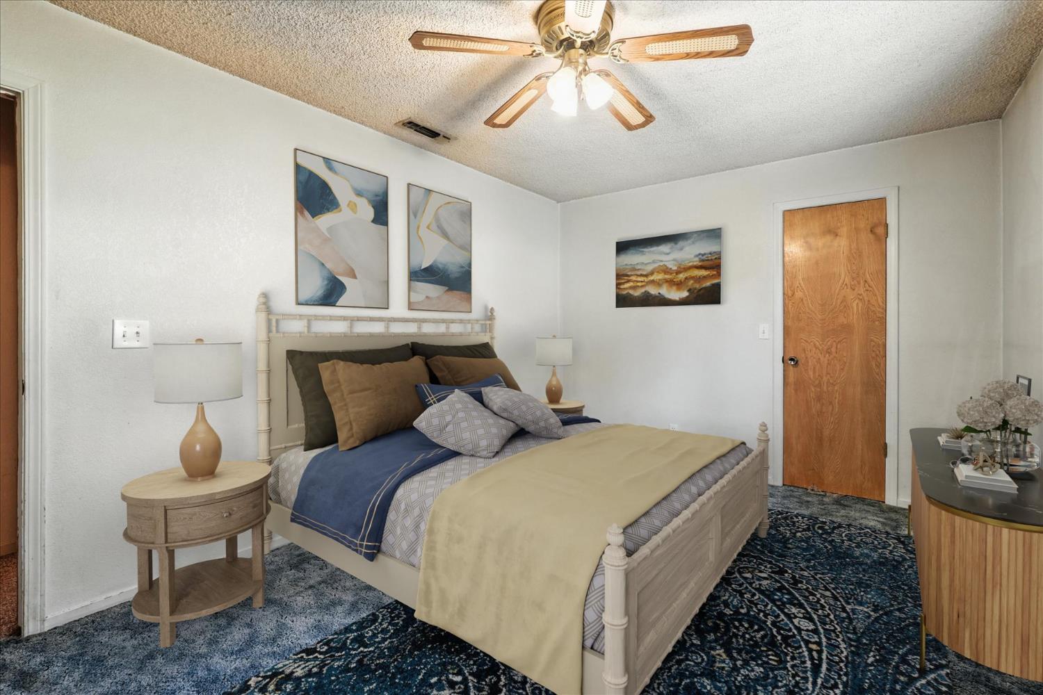 5783 Chowchilla Mountain Road Mariposa, CA 95338 - Photo 30 of 43 a bedroom with a bed and a chandelier