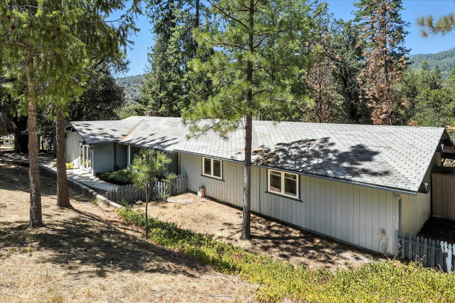 5783 Chowchilla Mountain Road Mariposa, CA 95338 - Photo 3 of 43 a view of a house with a yard