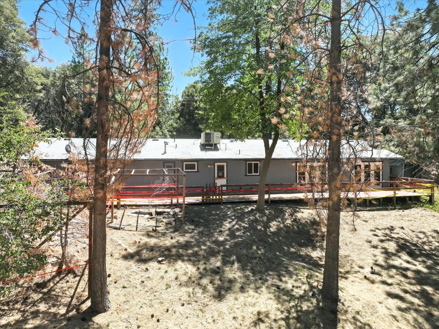 5783 Chowchilla Mountain Road Mariposa, CA 95338 - Photo 42 of 43 a view of a house with a yard covered in snow
