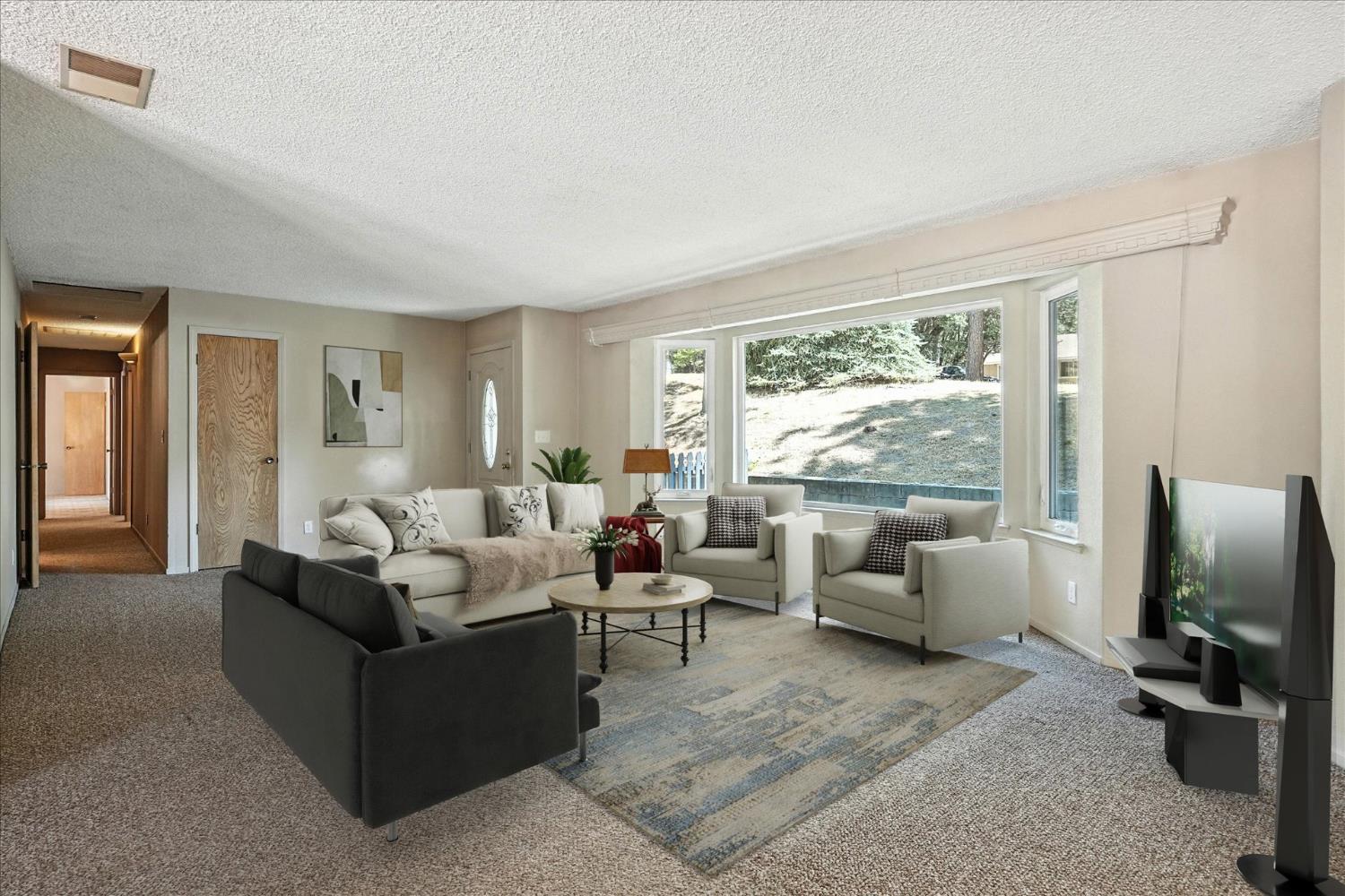 5783 Chowchilla Mountain Road Mariposa, CA 95338 - Photo 7 of 43 a living room with furniture large window and flat screen tv