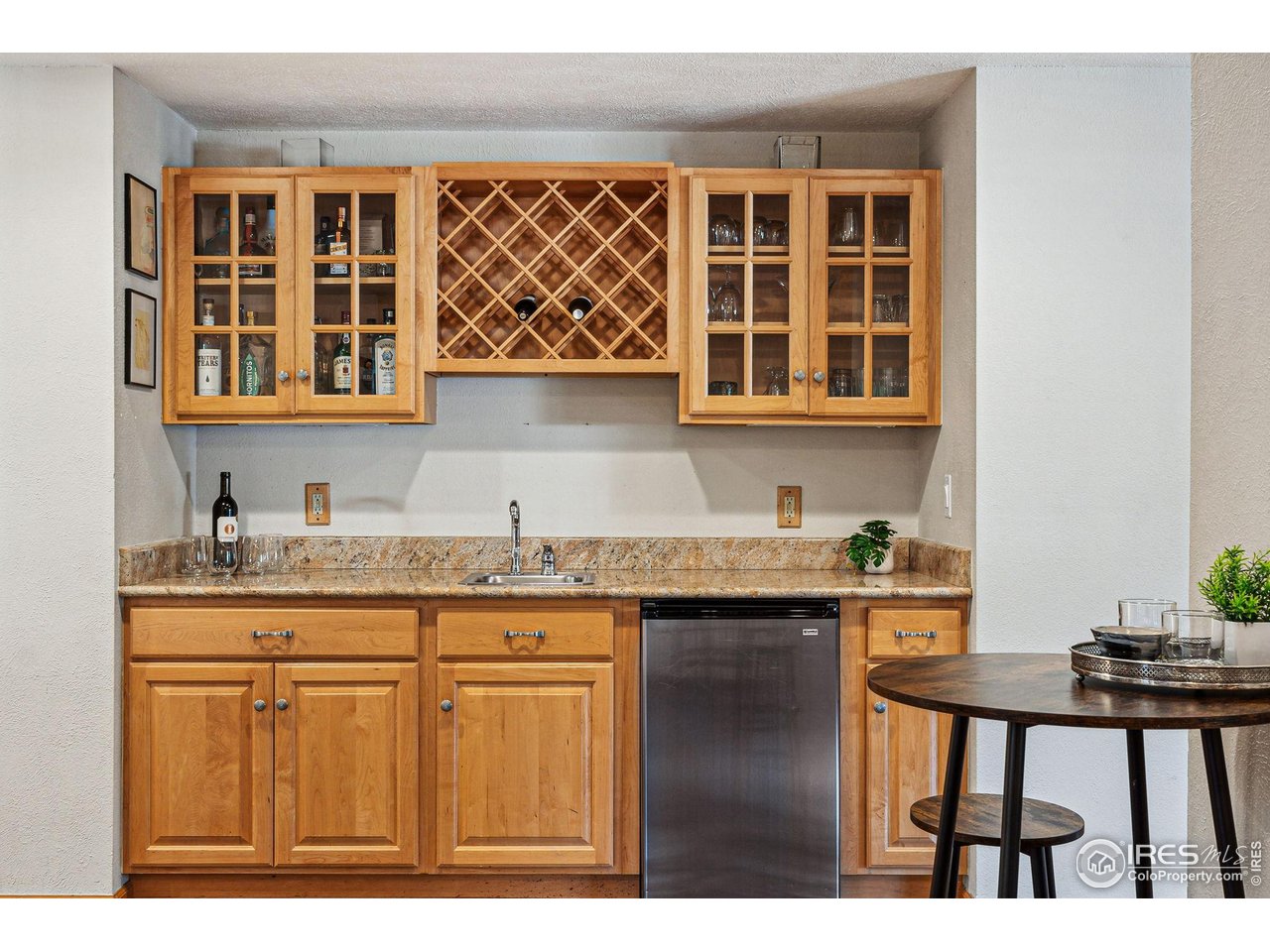 5604 Bowron Place Longmont, CO 80503 - Photo 12 of 37 a kitchen with a sink cabinets and wooden floor