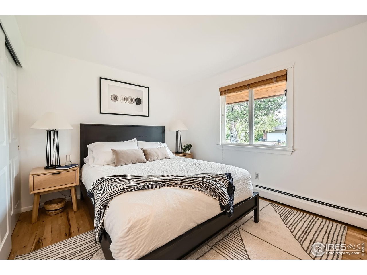5604 Bowron Place Longmont, CO 80503 - Photo 18 of 37 a bedroom with a bed and a night stand