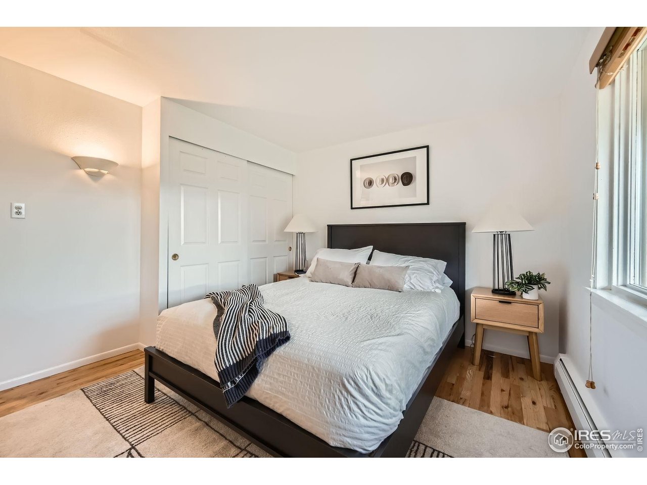 5604 Bowron Place Longmont, CO 80503 - Photo 19 of 37 a bedroom with a bed and a table