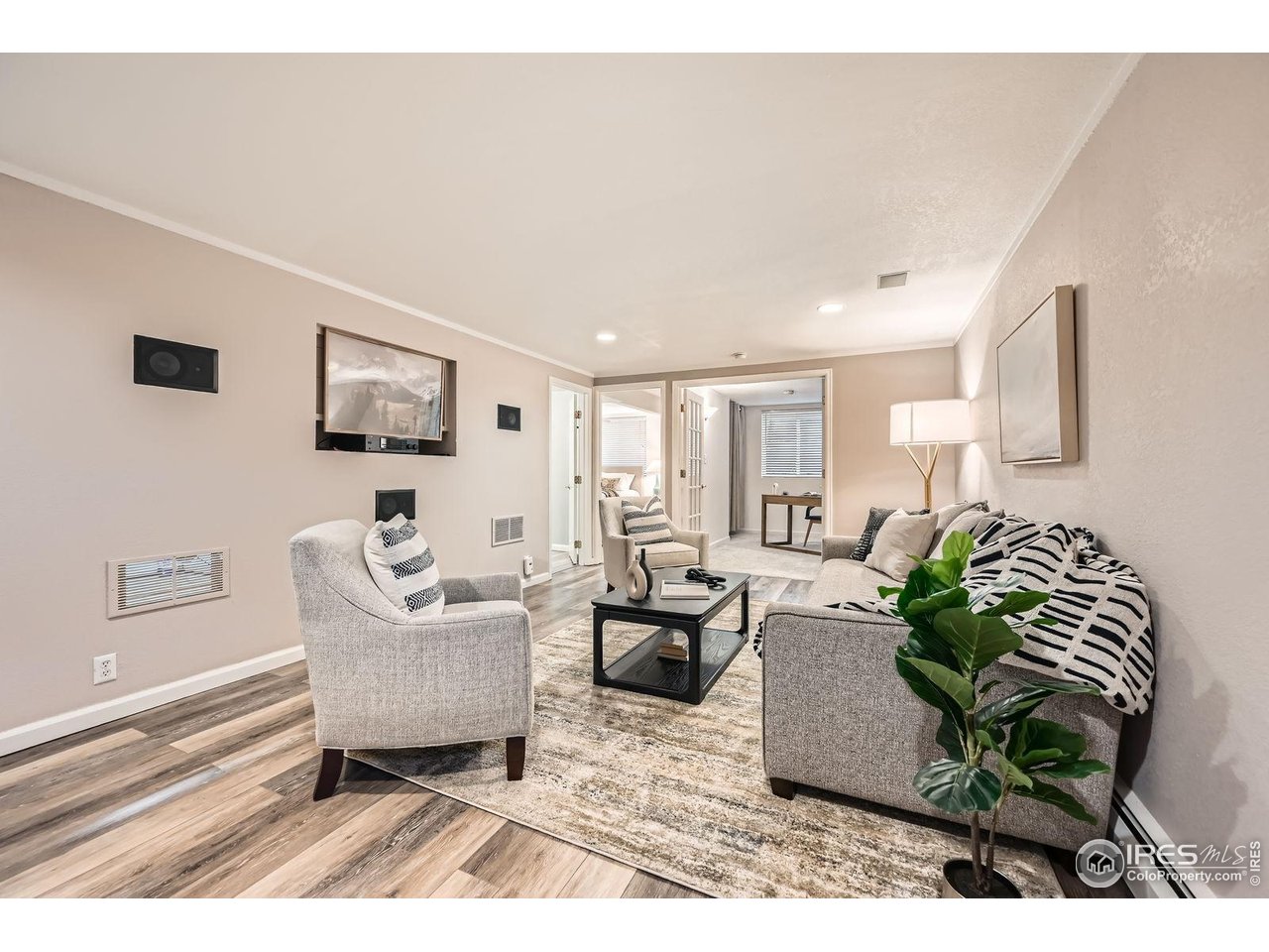 5604 Bowron Place Longmont, CO 80503 - Photo 20 of 37 a living room with furniture and a potted plant