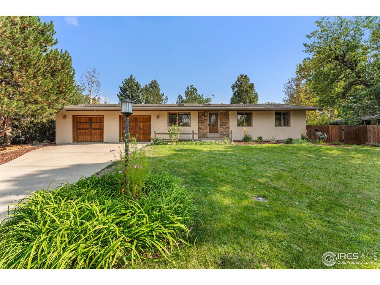 5604 Bowron Place Longmont, CO 80503 - Photo 2 of 37 a front view of house with yard and green space