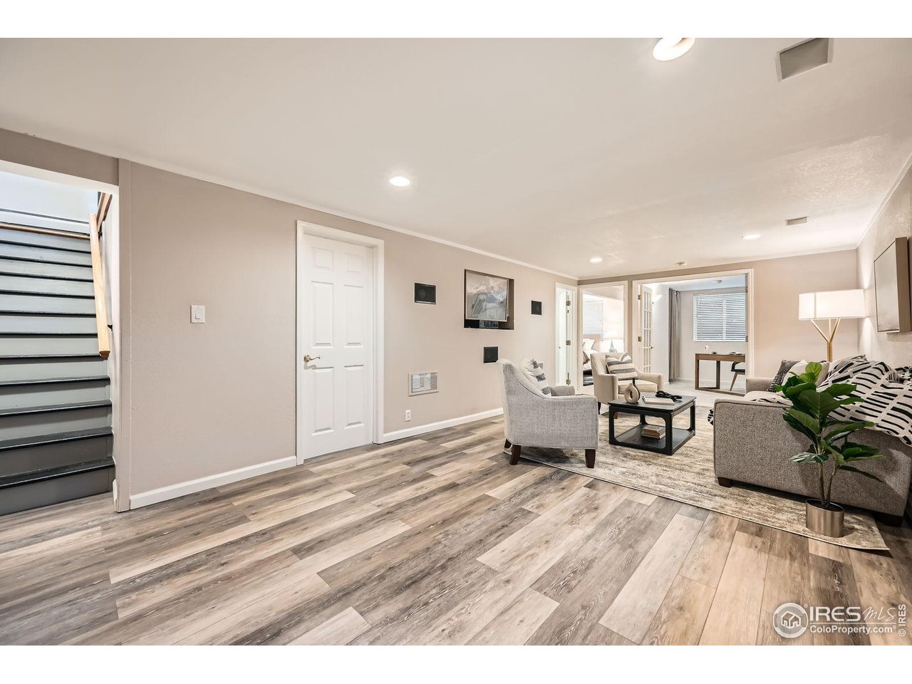 5604 Bowron Place Longmont, CO 80503 - Photo 21 of 37 a living room with furniture and a large window
