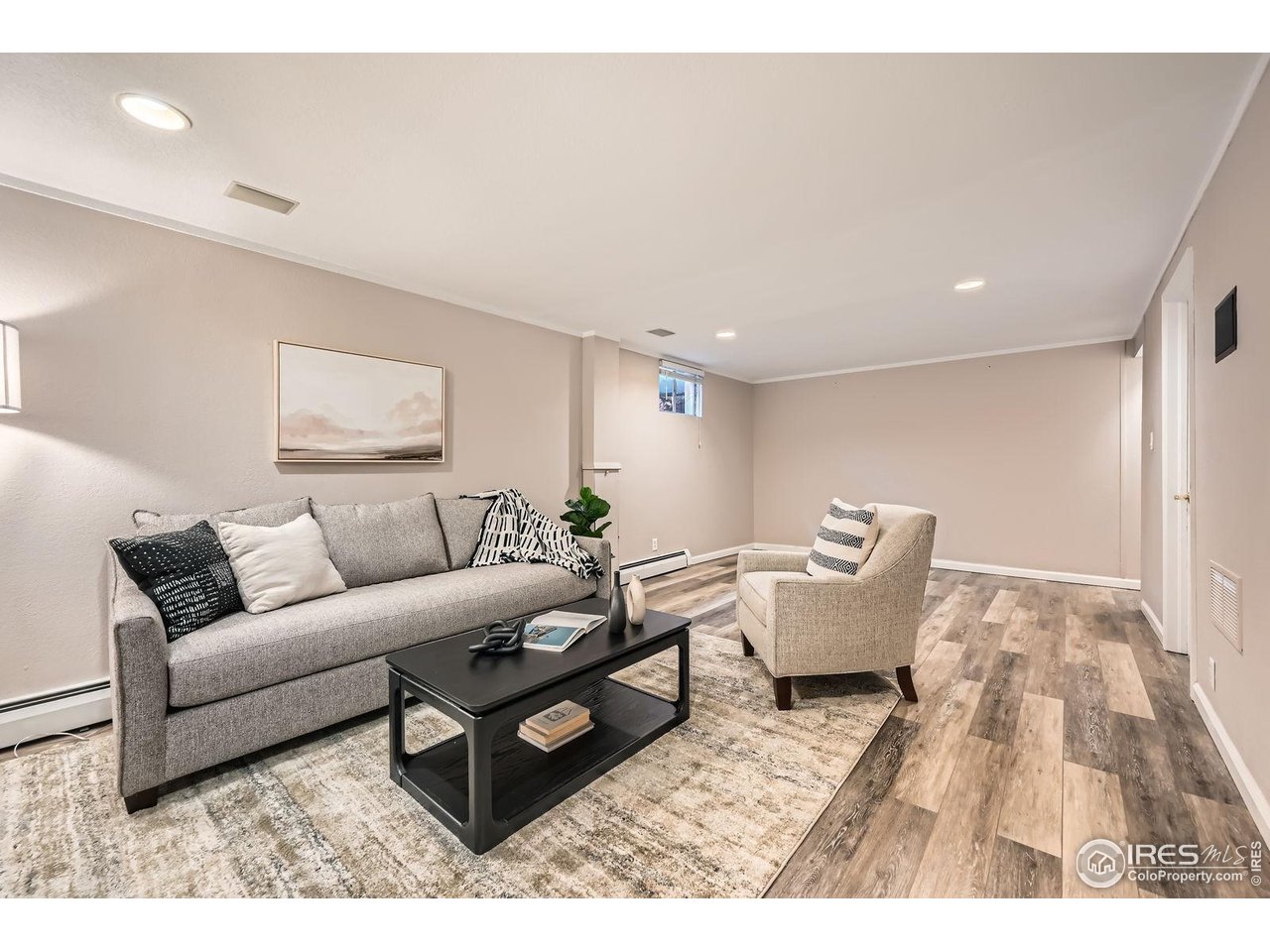 5604 Bowron Place Longmont, CO 80503 - Photo 22 of 37 a living room with furniture and wooden floor