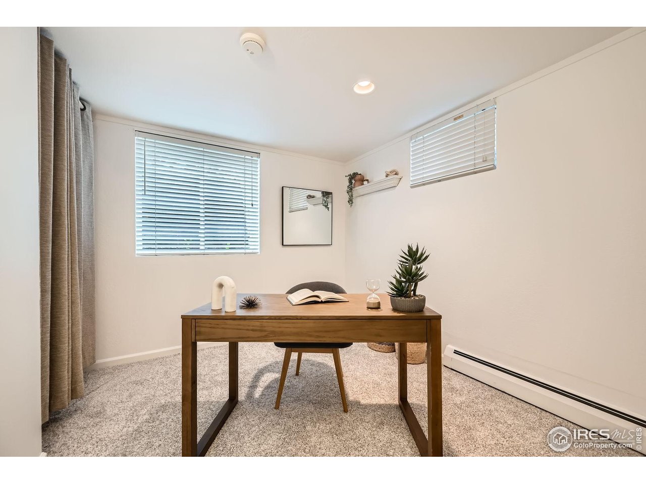 5604 Bowron Place Longmont, CO 80503 - Photo 27 of 37 a dining room with a table and chairs