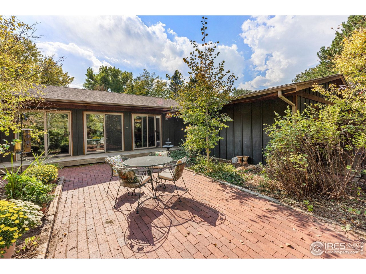 5604 Bowron Place Longmont, CO 80503 - Photo 30 of 37 a view of a house with backyard and sitting area