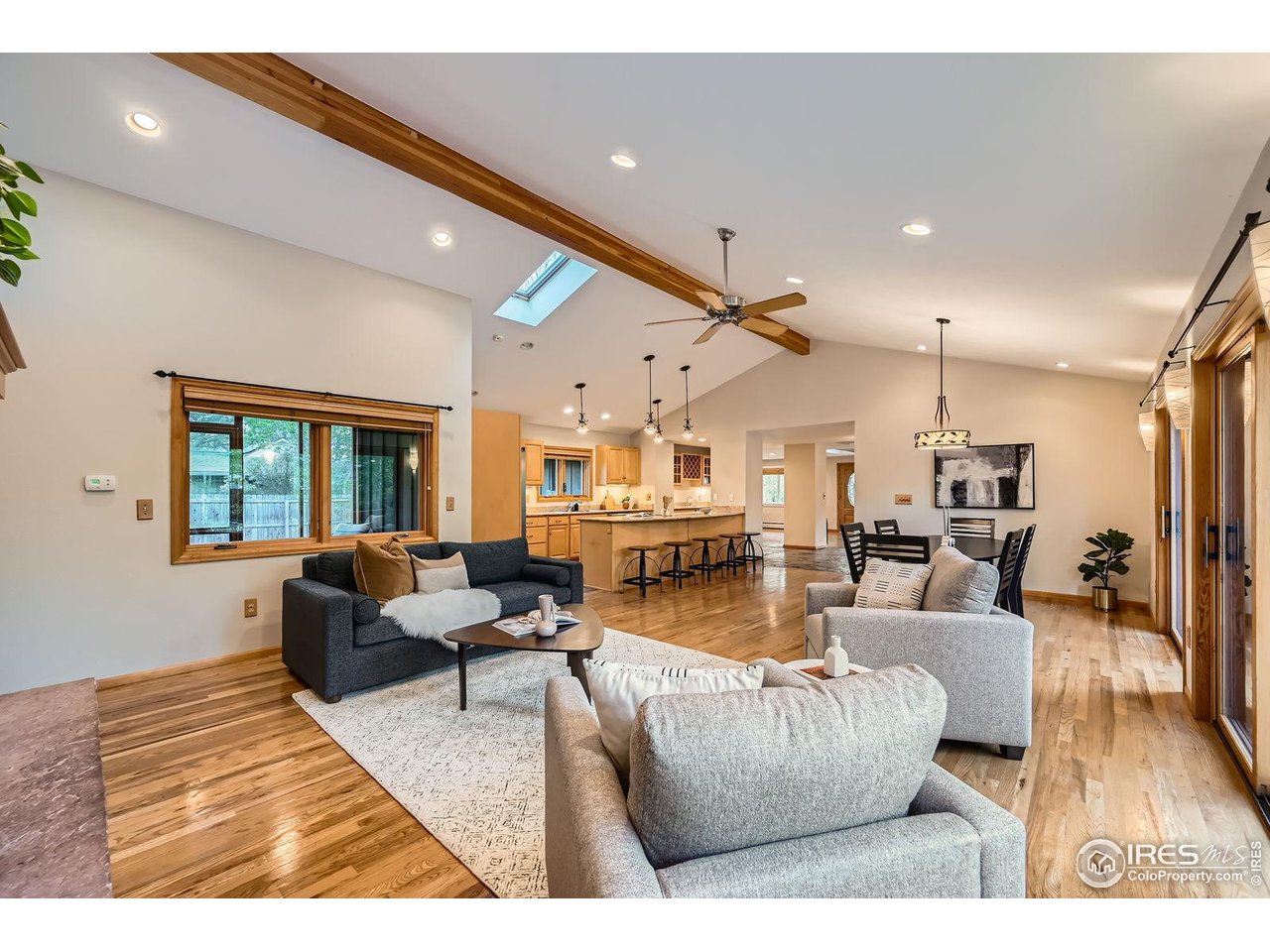 5604 Bowron Place Longmont, CO 80503 - Photo 4 of 37 a living room with furniture and a large window