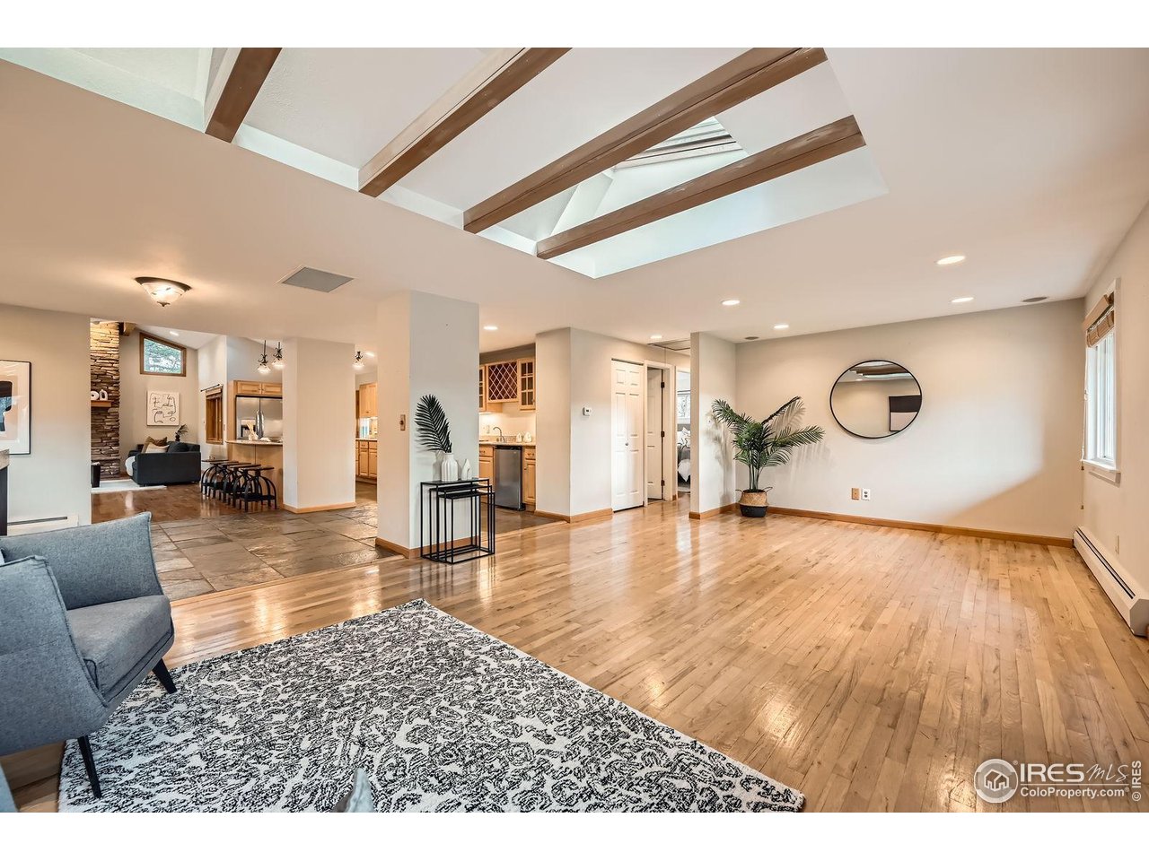5604 Bowron Place Longmont, CO 80503 - Photo 5 of 37 a living room with furniture and a wooden floor