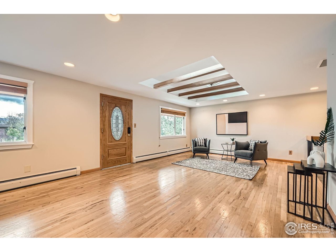 5604 Bowron Place Longmont, CO 80503 - Photo 7 of 37 a living room with furniture and wooden floor
