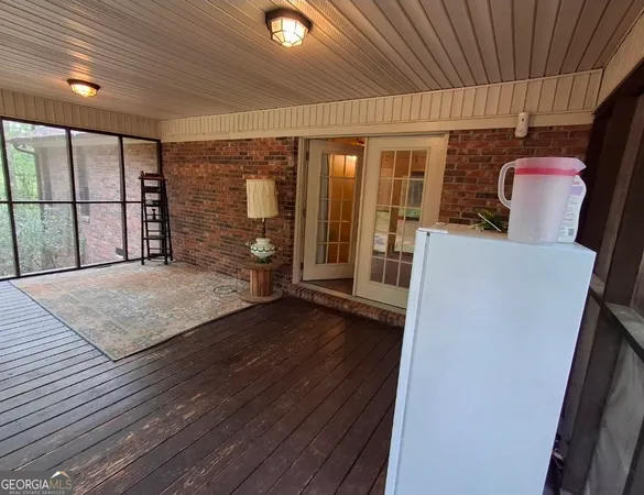 a view of outdoor space with deck and trees