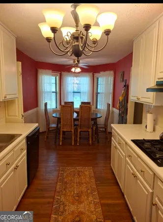 a large kitchen with lots of counter space a sink and appliances