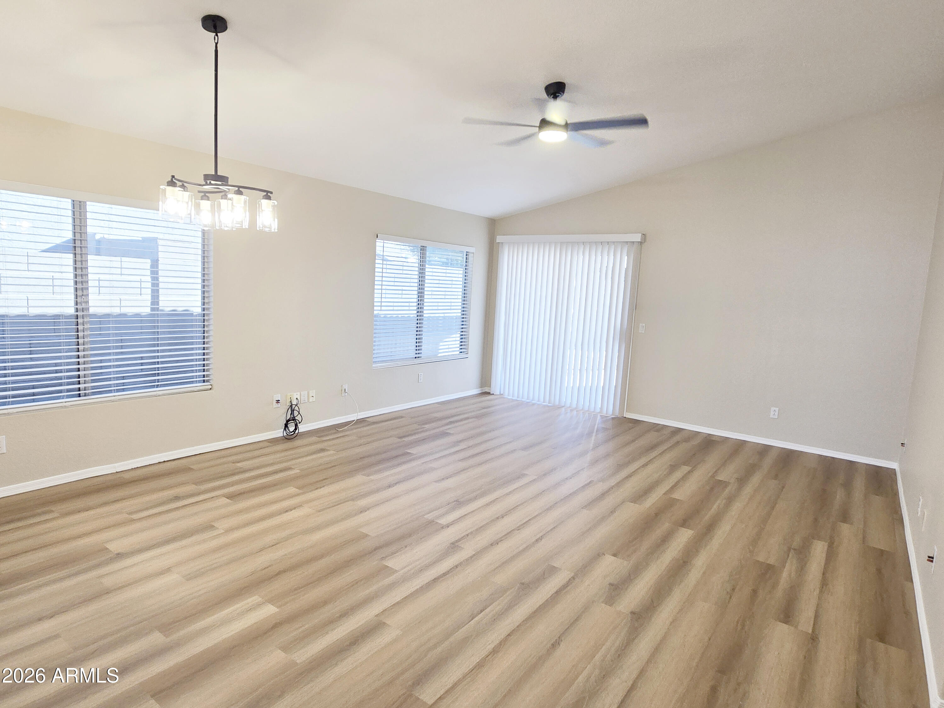 697 West Golden Street Gilbert, AZ 85233 - Photo 12 of 33 a view of empty room with wooden floor and fan