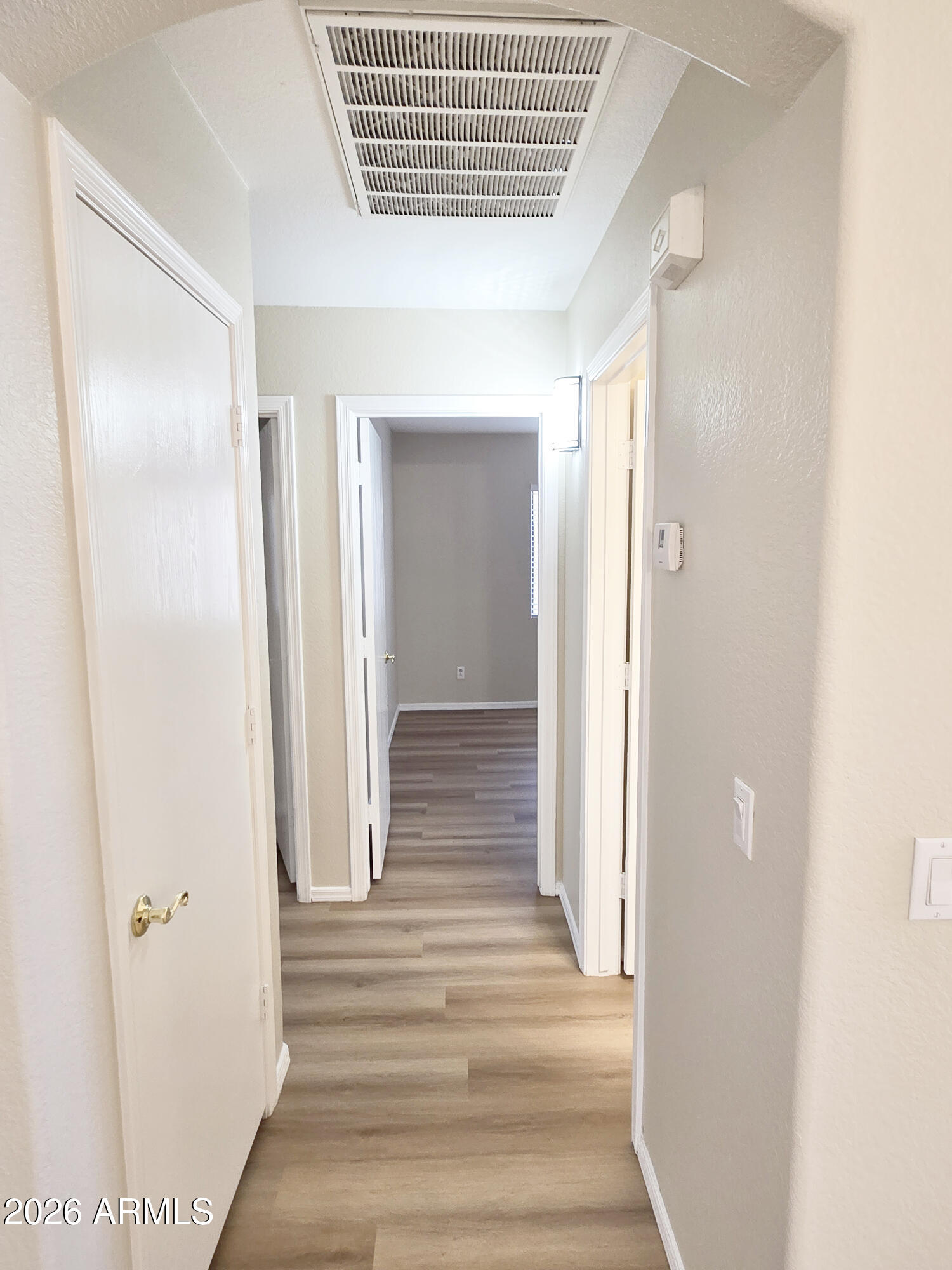697 West Golden Street Gilbert, AZ 85233 - Photo 16 of 33 a view of a hallway with wooden floor and closet