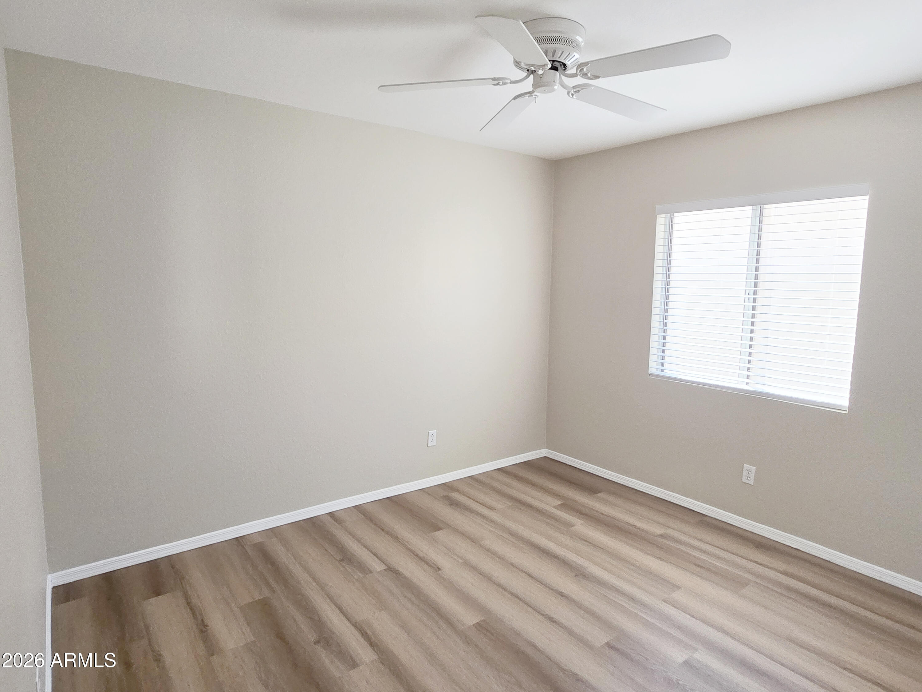 697 West Golden Street Gilbert, AZ 85233 - Photo 22 of 33 wooden floor in an empty room with a window