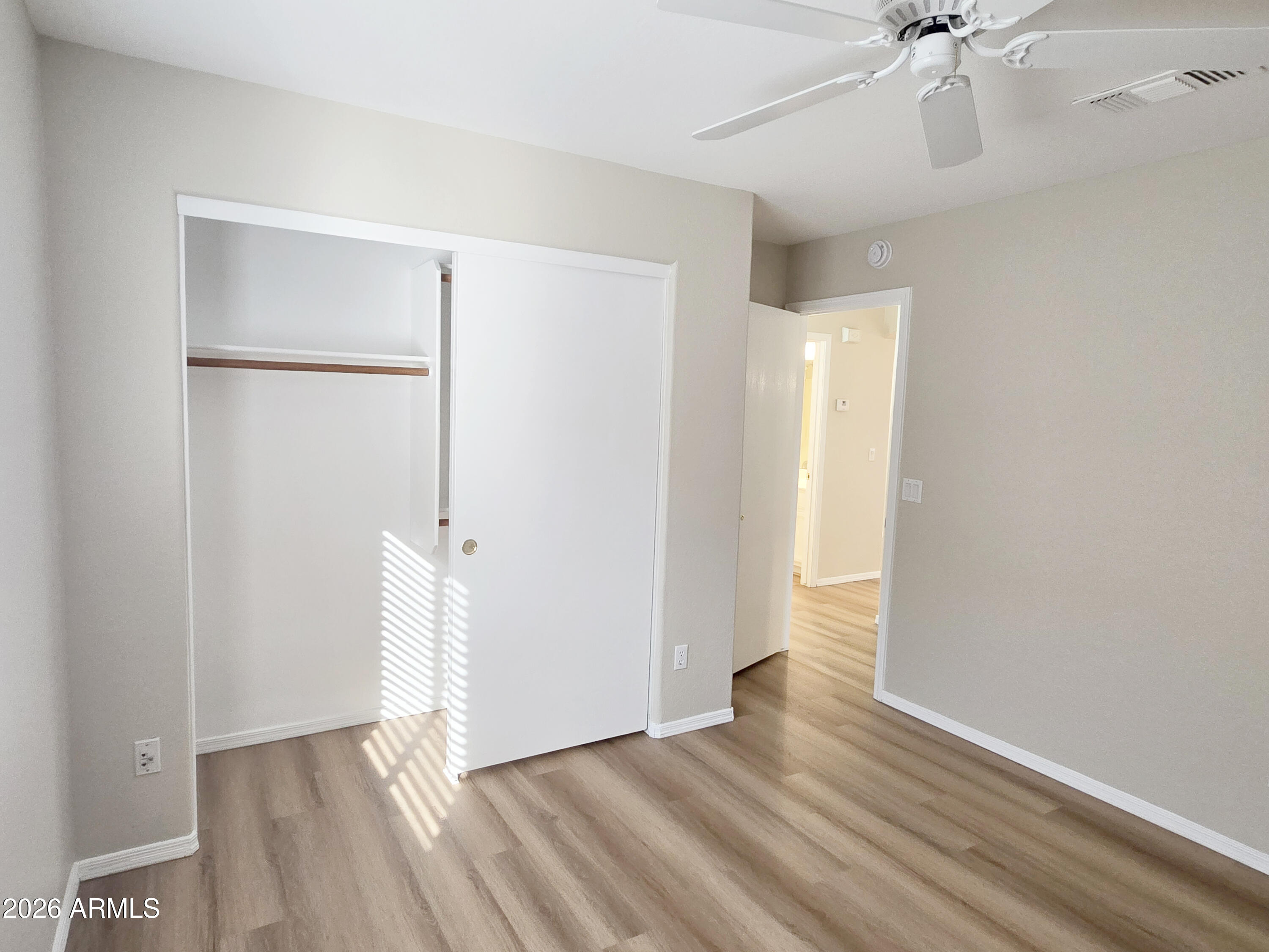 697 West Golden Street Gilbert, AZ 85233 - Photo 23 of 33 a view of an empty room with a window and wooden floor