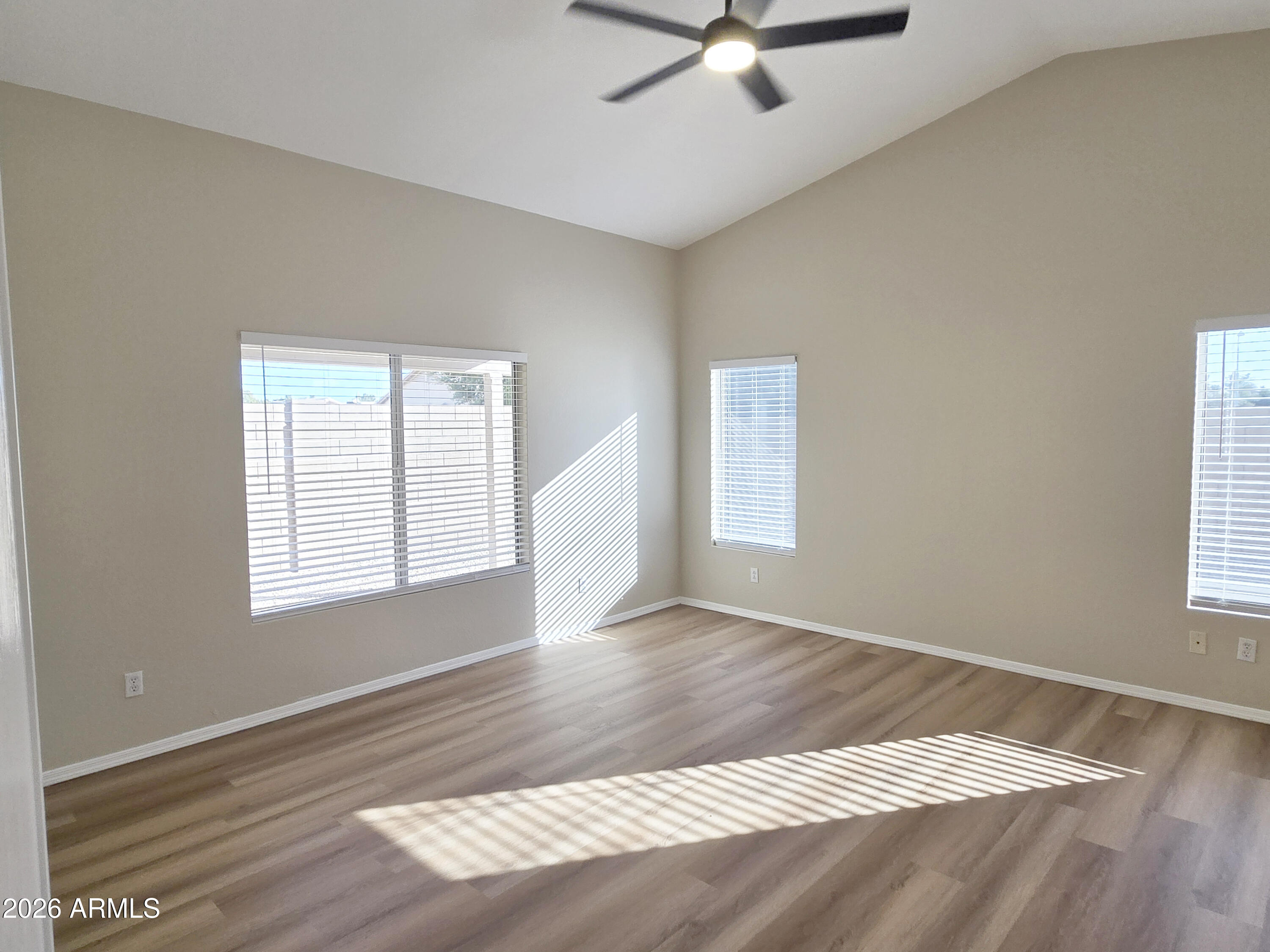 697 West Golden Street Gilbert, AZ 85233 - Photo 25 of 33 a view of an empty room with wooden floor and a window