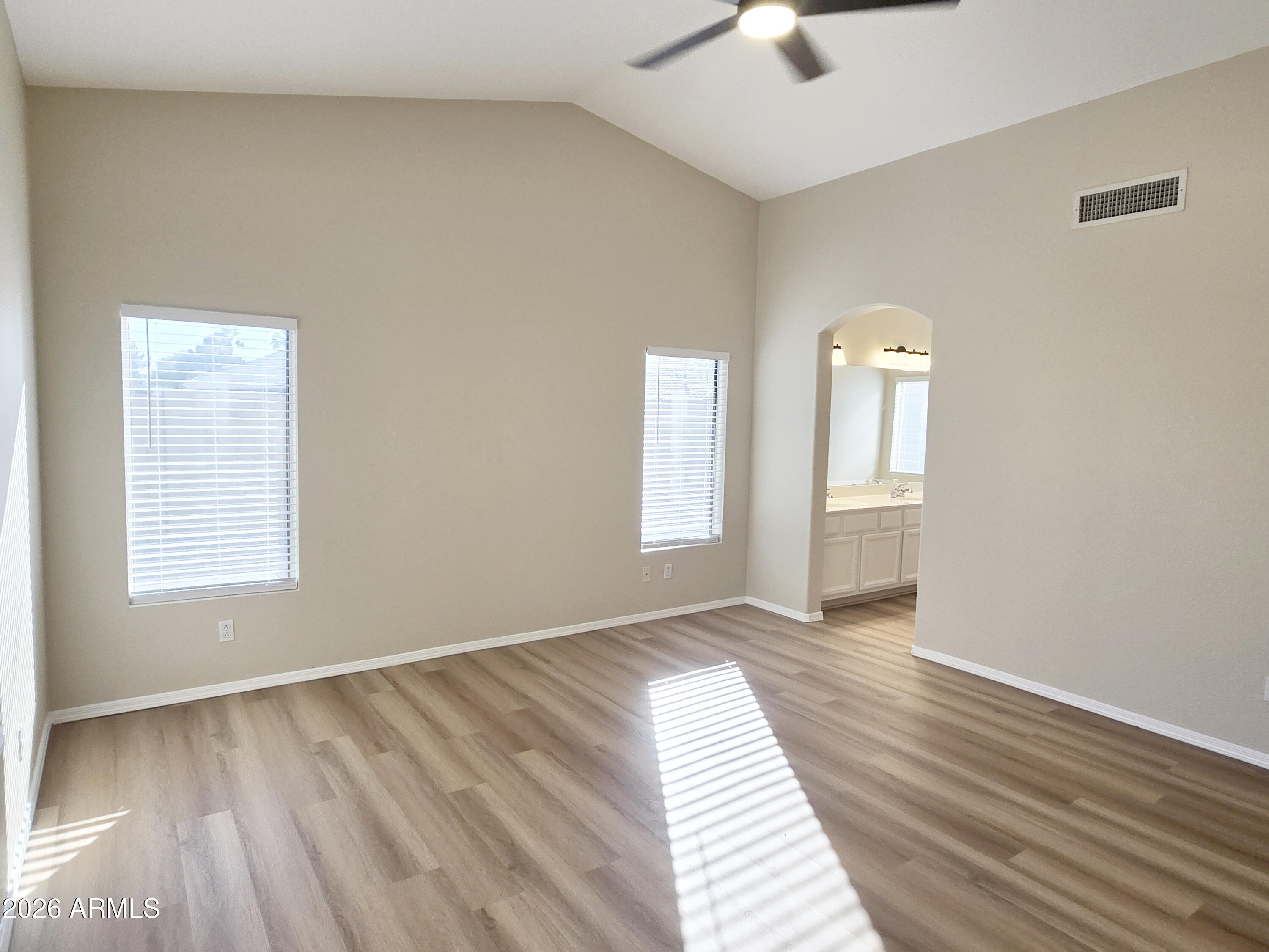 697 West Golden Street Gilbert, AZ 85233 - Photo 27 of 33 an empty room with wooden floor chandelier fan and windows