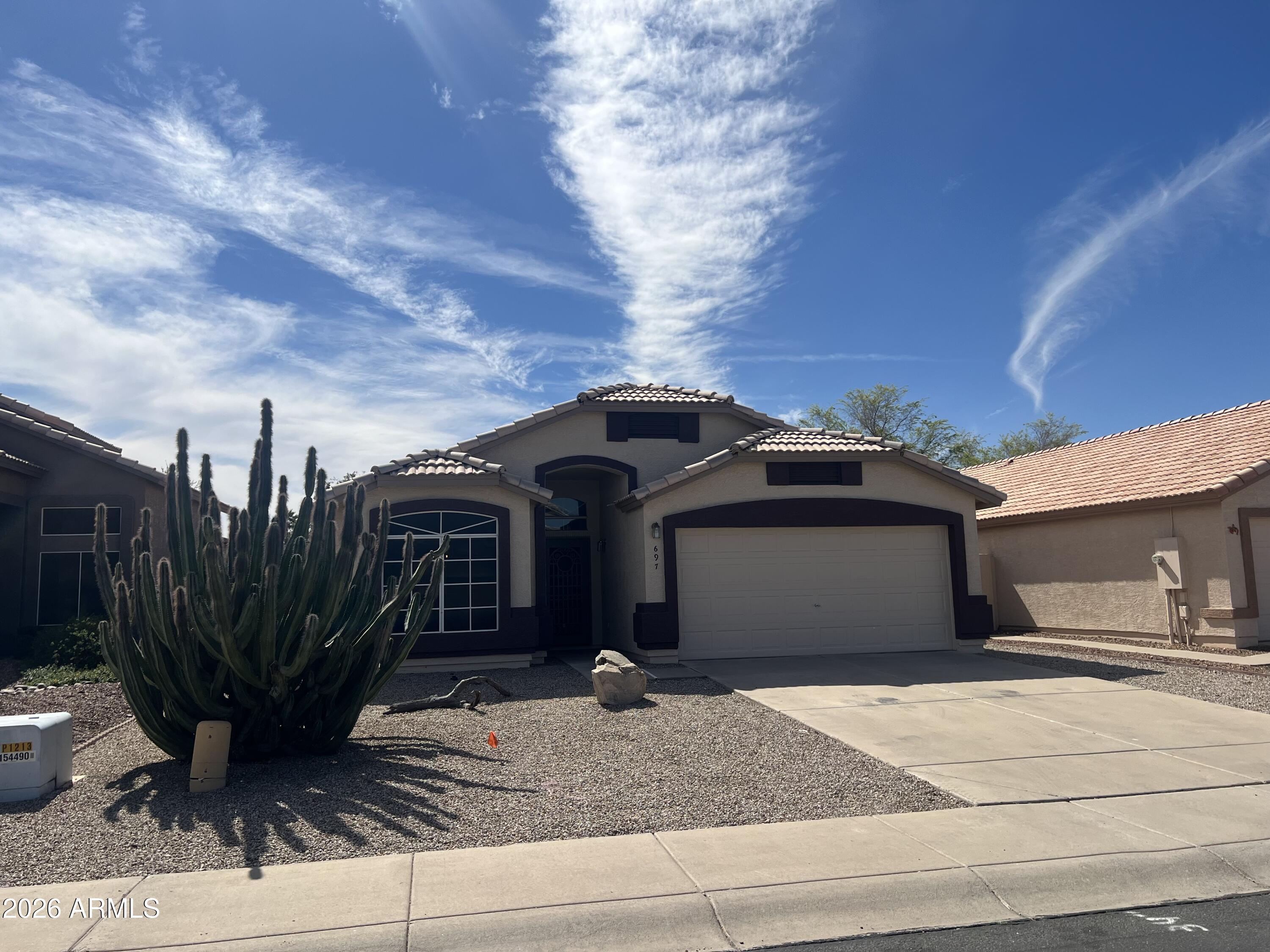 697 West Golden Street Gilbert, AZ 85233 - Photo 3 of 33 a front view of a house with garden space