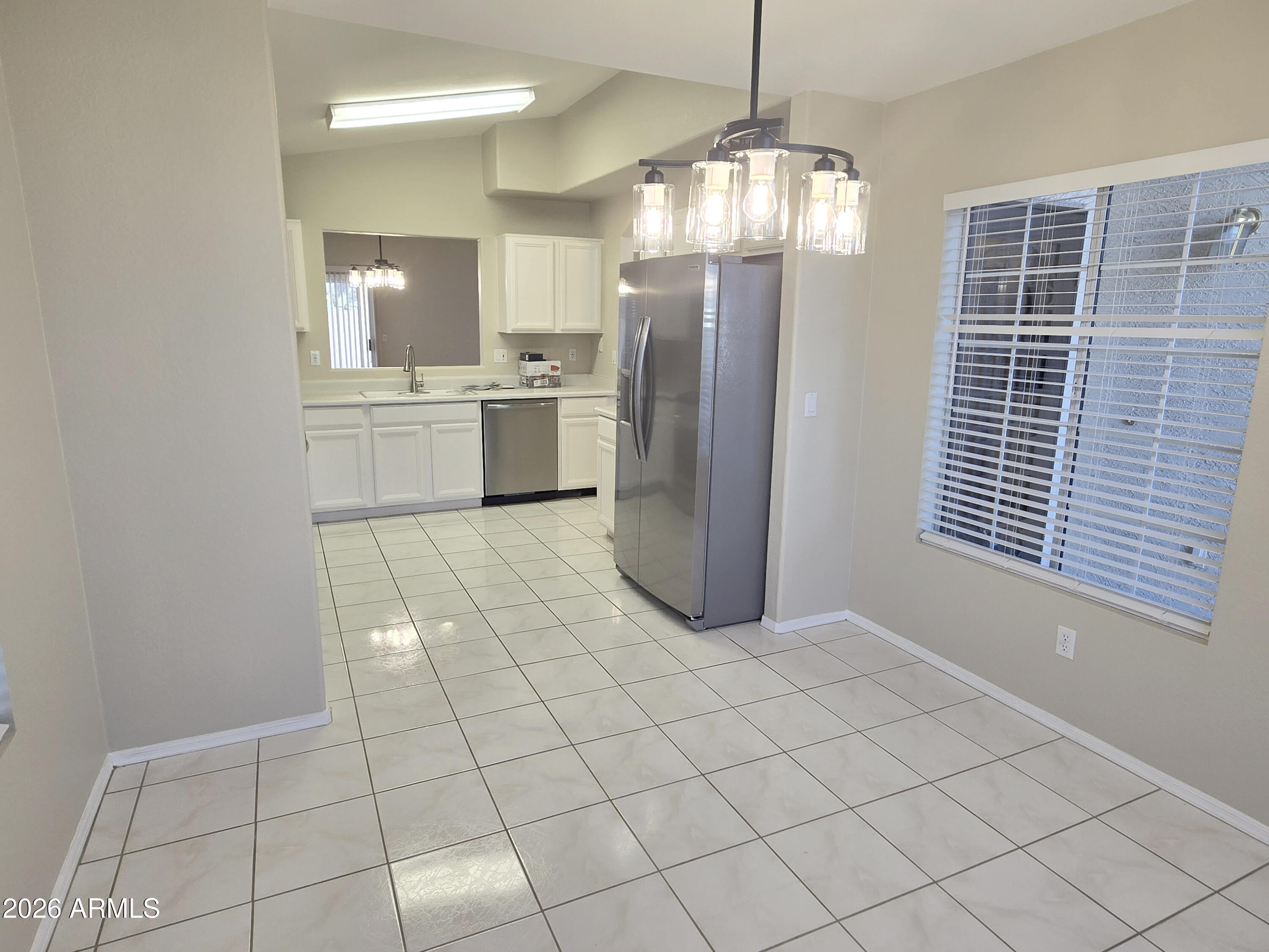 697 West Golden Street Gilbert, AZ 85233 - Photo 10 of 33 a view of kitchen and empty room with windows