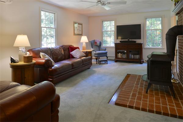 12 Janes Road Boxford, MA 01921 - Photo 9 of 25 a living room with furniture and a flat screen tv