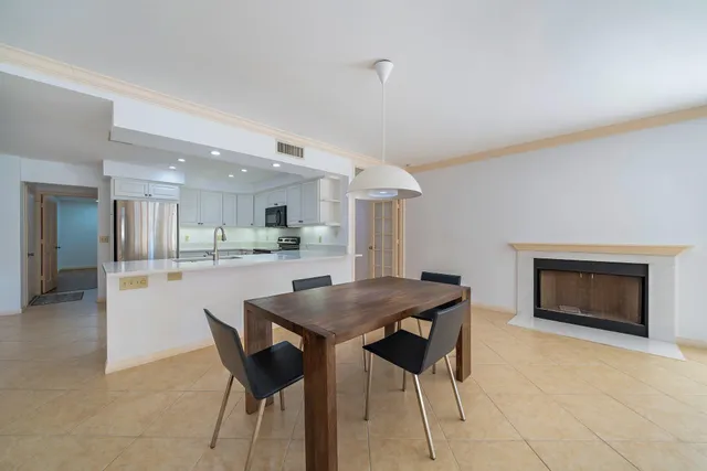 a kitchen with a table and chairs in it