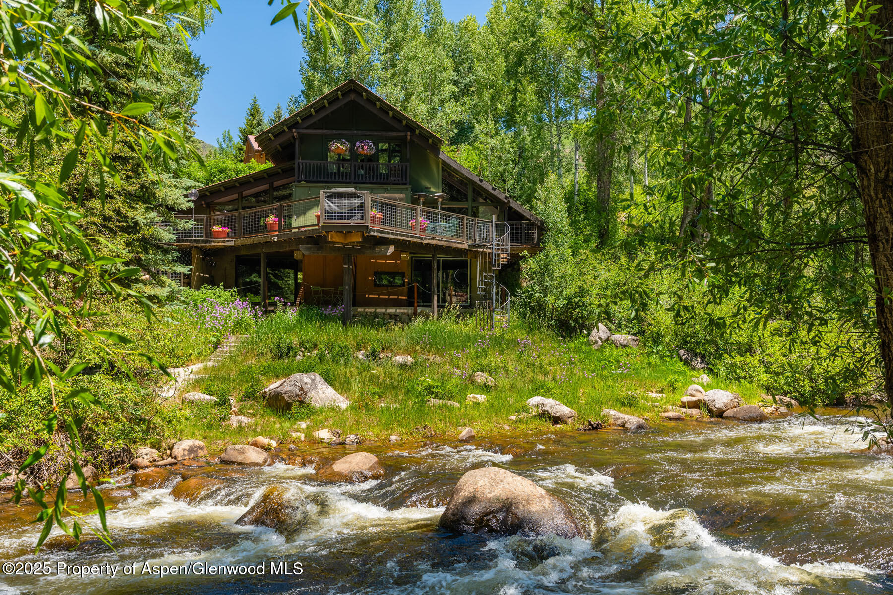 a backyard of a house with yard and outdoor seating