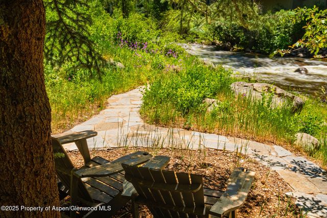 a view of yard with patio
