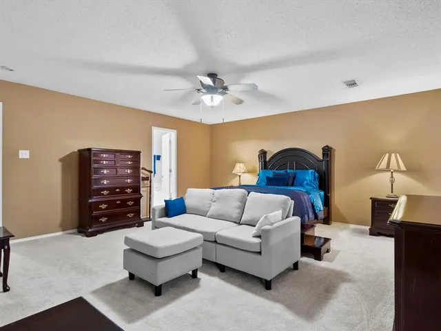 a en suite bathroom with a sink and a large mirror
