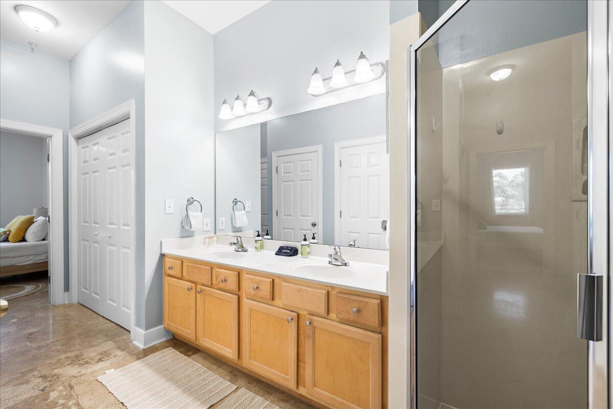231 Somerset Bridge Road, Unit 1209 Santa Rosa Beach, FL 32459 - Photo 12 of 22 a spacious bathroom with a double vanity sink and mirror