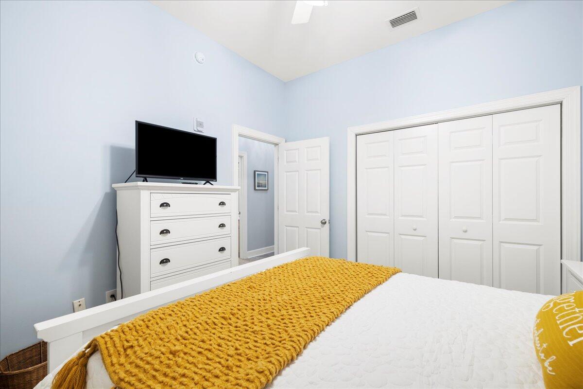 231 Somerset Bridge Road, Unit 1209 Santa Rosa Beach, FL 32459 - Photo 15 of 22 a bedroom with a bed and a flat screen tv