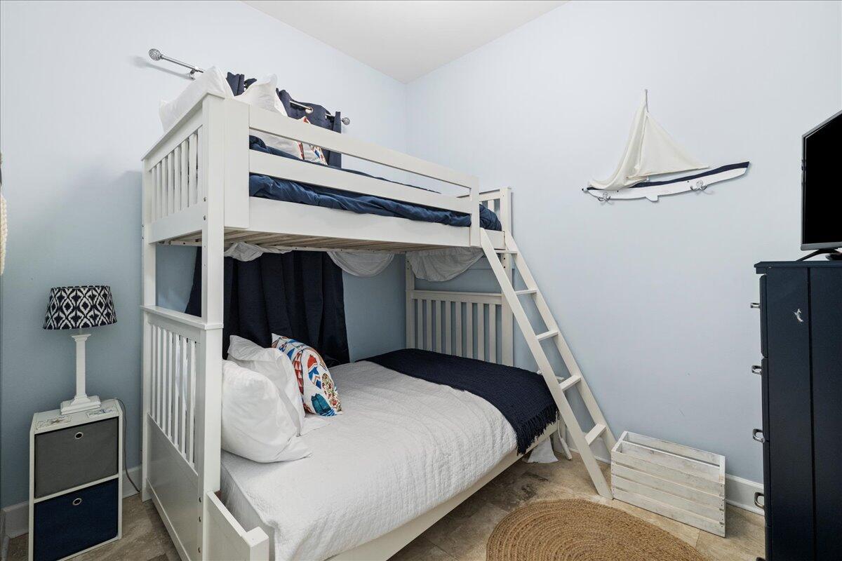 231 Somerset Bridge Road, Unit 1209 Santa Rosa Beach, FL 32459 - Photo 16 of 22 a bedroom with a bed and a white cabinet