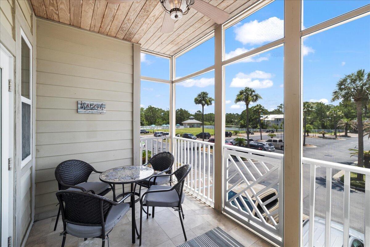 231 Somerset Bridge Road, Unit 1209 Santa Rosa Beach, FL 32459 - Photo 18 of 22 a view of a chairs and table in the balcony