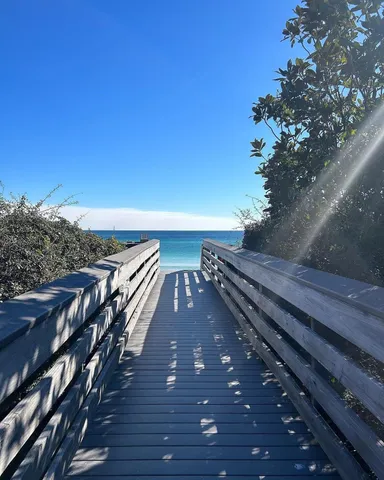 a view of a roof deck with wooden floor and fence