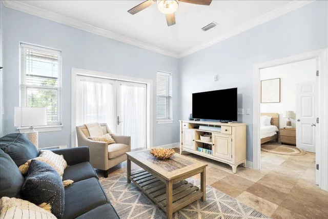 a living room with furniture and a flat screen tv