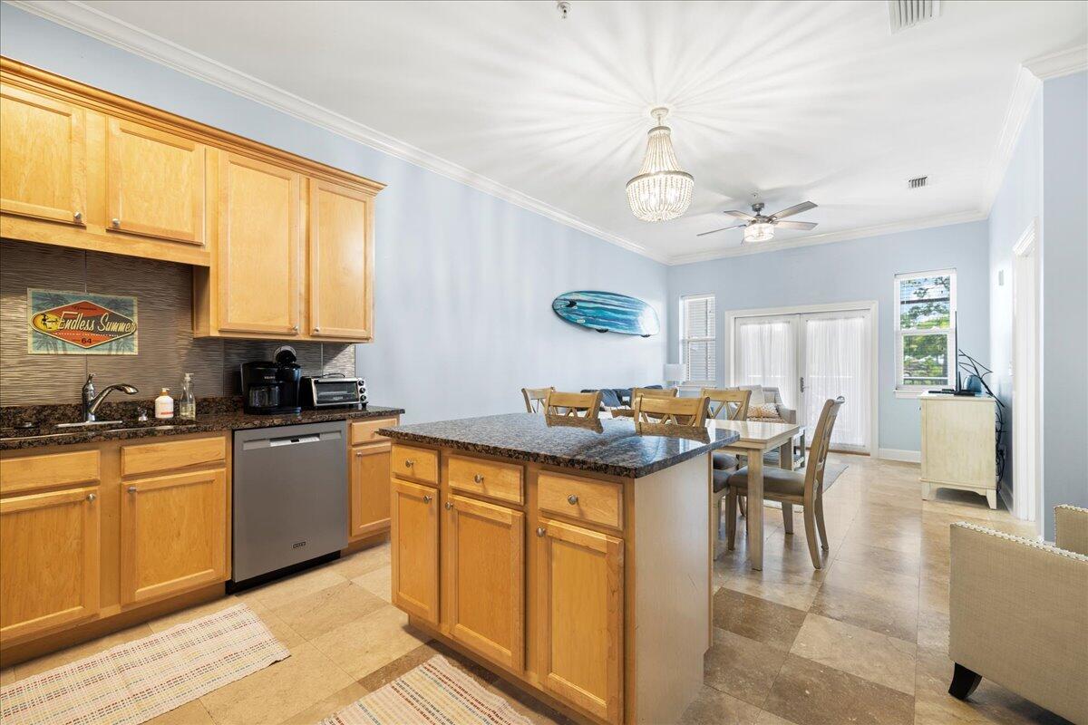 231 Somerset Bridge Road, Unit 1209 Santa Rosa Beach, FL 32459 - Photo 7 of 22 a kitchen with a stove a sink a dining table and chairs