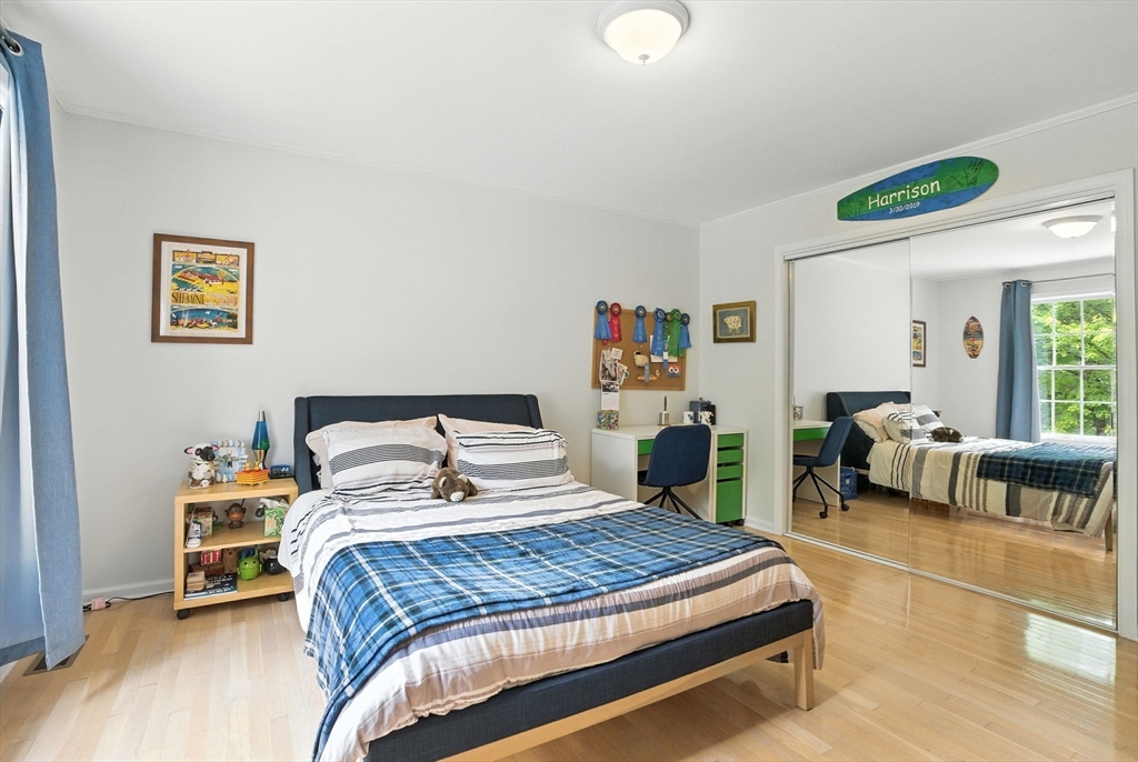 7 Alder Way, Unit 7 Bedford, MA 01730 - Photo 18 of 30 a bedroom with bed and a couch