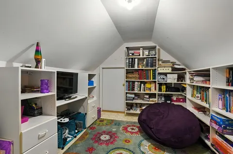 a workspace with furniture and book shelf