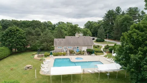 a view of a house with backyard porch and furniture