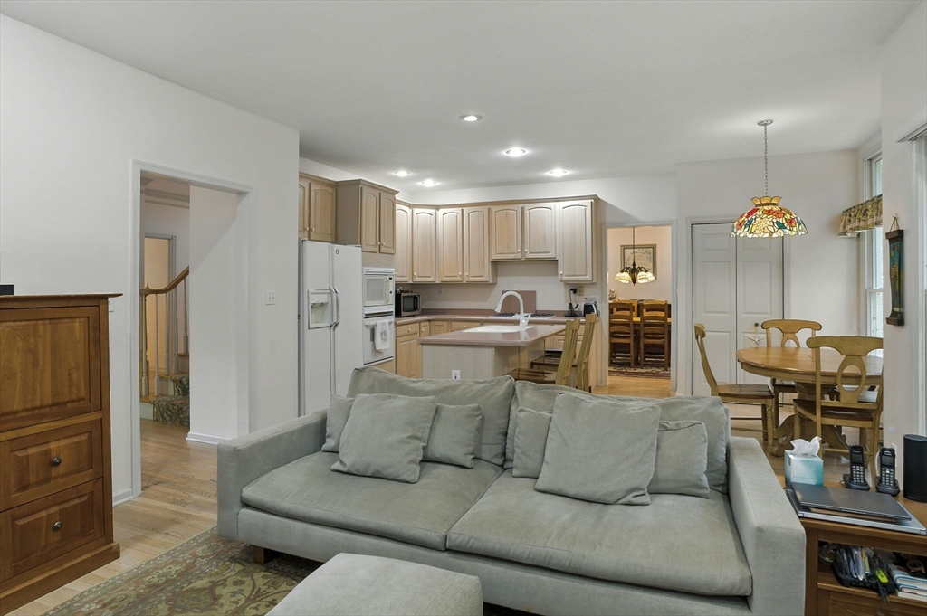 7 Alder Way, Unit 7 Bedford, MA 01730 - Photo 7 of 30 a living room with furniture and a view of kitchen