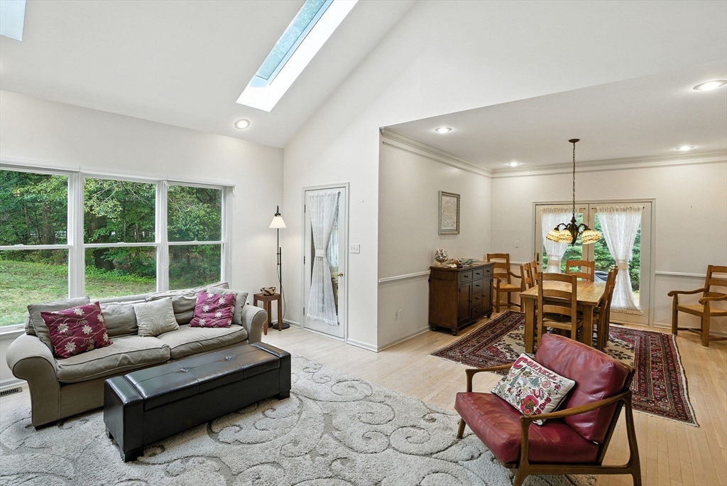 7 Alder Way, Unit 7 Bedford, MA 01730 - Photo 8 of 30 a living room with furniture and a floor to ceiling window