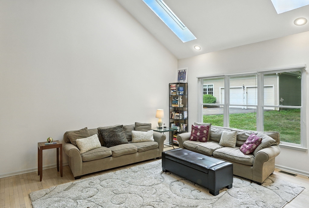 7 Alder Way, Unit 7 Bedford, MA 01730 - Photo 9 of 30 a living room with furniture and a large window