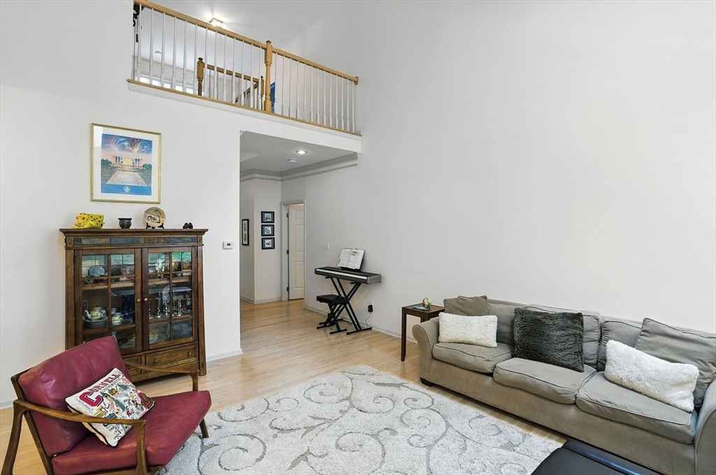 7 Alder Way, Unit 7 Bedford, MA 01730 - Photo 10 of 30 a living room with furniture and wooden floor